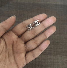 Flat opposite 'C' studs in pure silver