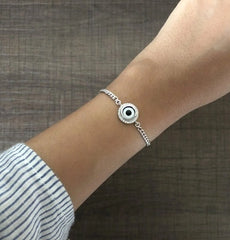1.2 cm diameter multi cz stone studded evil eye 7'' long adjustable bracelet in pure silver