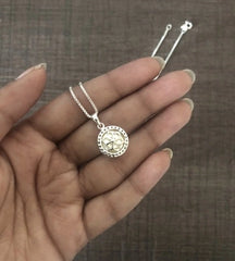 1.4 cm diameter pearl pendant with a multiple cz stone border and an 18’’ chain in pure silver