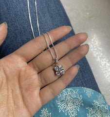 1cm diameter four cz stone pendant with an 18’’ chain in pure silver