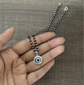 1.2 cm diameter multi cz stone studded evil eye pendant with an 18'' mangalsutra chain in pure silver