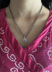 1.2 cm diameter multi cz stone studded evil eye pendant with an 18'' mangalsutra chain in pure silver