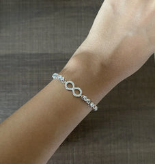 4mm cz stone studded infinity pattern adjustable bracelet in pure silver
