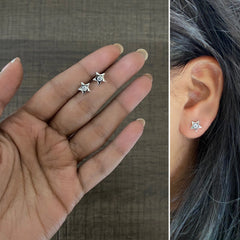Small star studs with a 3 mm cz stone set in pure silver