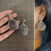 Intricate cut work dangling studs crafted in pure silver