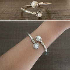 Round rava pattern natural pearl center twisted kada in pure silver