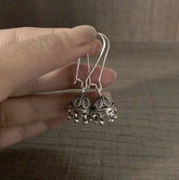 Antique finish small size jhumkas with a lockable loop in pure silver