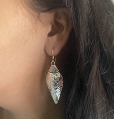 Shell shape beaten texture handmade earrings in pure silver