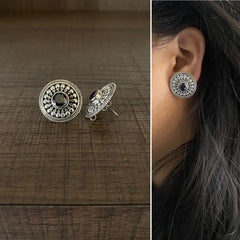 2.1 cm diameter carving rava work studs with a black onyx cut stone center in pure silver