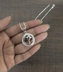 2.2 cm diameter multi cz stone studded Om motif pendant with an 18'' chain in pure silver