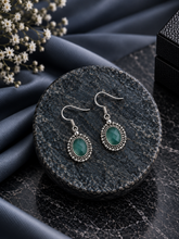 Green onyx oval cut stone rava border hangings in pure silver
