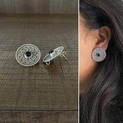 2.5 cm diameter rava work studs with a black onyx center in pure silver