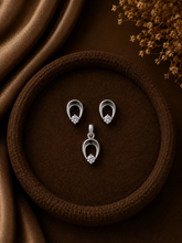 Single cz stone peacock feather pattern earrings and pendant set in pure silver