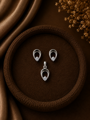 Single cz stone peacock feather pattern earrings and pendant set in pure silver