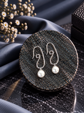 Spiral earrings crafted in pure silver with round pearl drops