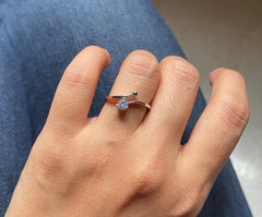 Single 4mm cz stone with a one side curved border ring in pure silver