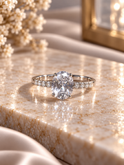 Oval cz ring with a half studded band in pure silver