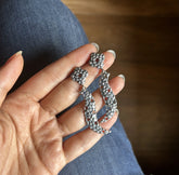 Flower and knife pattern beaten texture dangling studs in pure silver