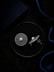 2.5 cm diameter rava work studs with a pearl center in pure silver
