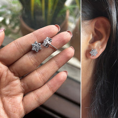 Nakshtra setting seven cz stone flower studs in pure silver