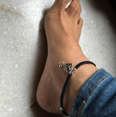 Birdie motif adjustable anklet made in pure silver with a waxed cotton black thread