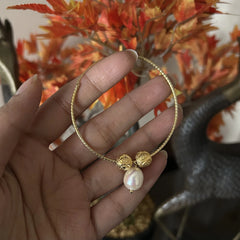 5cm textured balis with frosted balls and fresh water pearl drops with 22 kt gold plating set in pure silver