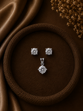 7mm four prong cz stone studs with an 8mm cz stone pendant in pure silver