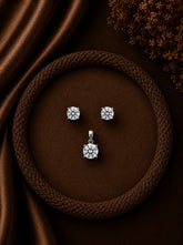 6mm four prong cz stone studs with a matching 7mm cz pendant in pure silver