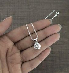 9mm diameter cz stone pendant with an 18'' chain in pure silver
