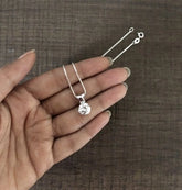 9mm diameter cz stone pendant with an 18'' chain in pure silver