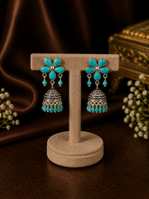Turquoise stone flower stud pattern jhumkas in pure silver