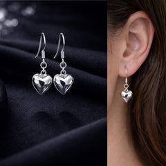 Hollow heart shape earrings in pure silver