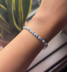 Evil eye with cz stones in flower pattern adjustable tennis bracelet in pure silver