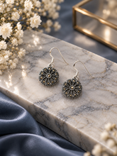Delicate marcasite flower hanging in pure silver