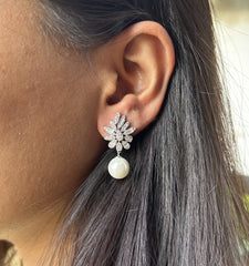 Uneven cz cut stone studs with pearl drops in pure silver