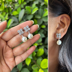 Four cz stone studs with round 10mm pearl drops in pure silver