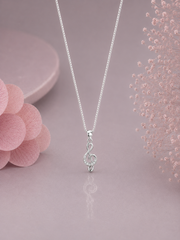 Mini musical note pendant with multiple cz stones with an 18 inch chain in pure silver