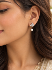 Lotus pattern cz studded earrings with small pearl drops in pure silver