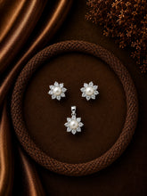 Compact 9mm diameter flower cz stone earrings and pendant set with a pearl center in pure silver