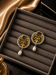 Filigree cut work balis with pearl drops with a two tone look made in pure silver with 22 kt. gold plating