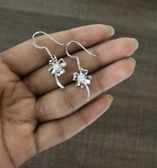 Delicate flower motif hangings with a cz stone in pure silver