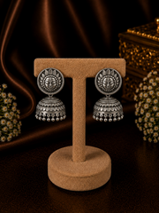 Antique finish Surya face studs with carving work jhumkas in pure silver