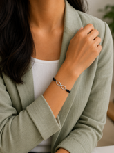 Infinity motif adjustable hand braided bracelet made in pure silver