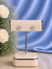 Flat flower studs with a single cz stone crafted in pure silver