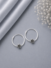 2.5cm diameter thin balis with a flower bead in pure silver