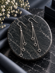 Heart cut out hanging earrings in pure silver