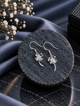 Delicate flower motif hangings with a cz stone in pure silver