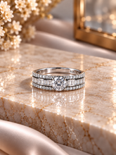 Engagement style studded three line ring with a 6mm elevated cz stone center in pure silver