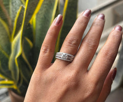 Engagement style studded three line ring with a 6mm elevated cz stone center in pure silver
