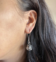 Antique finish small size jhumkas with a lockable loop in pure silver